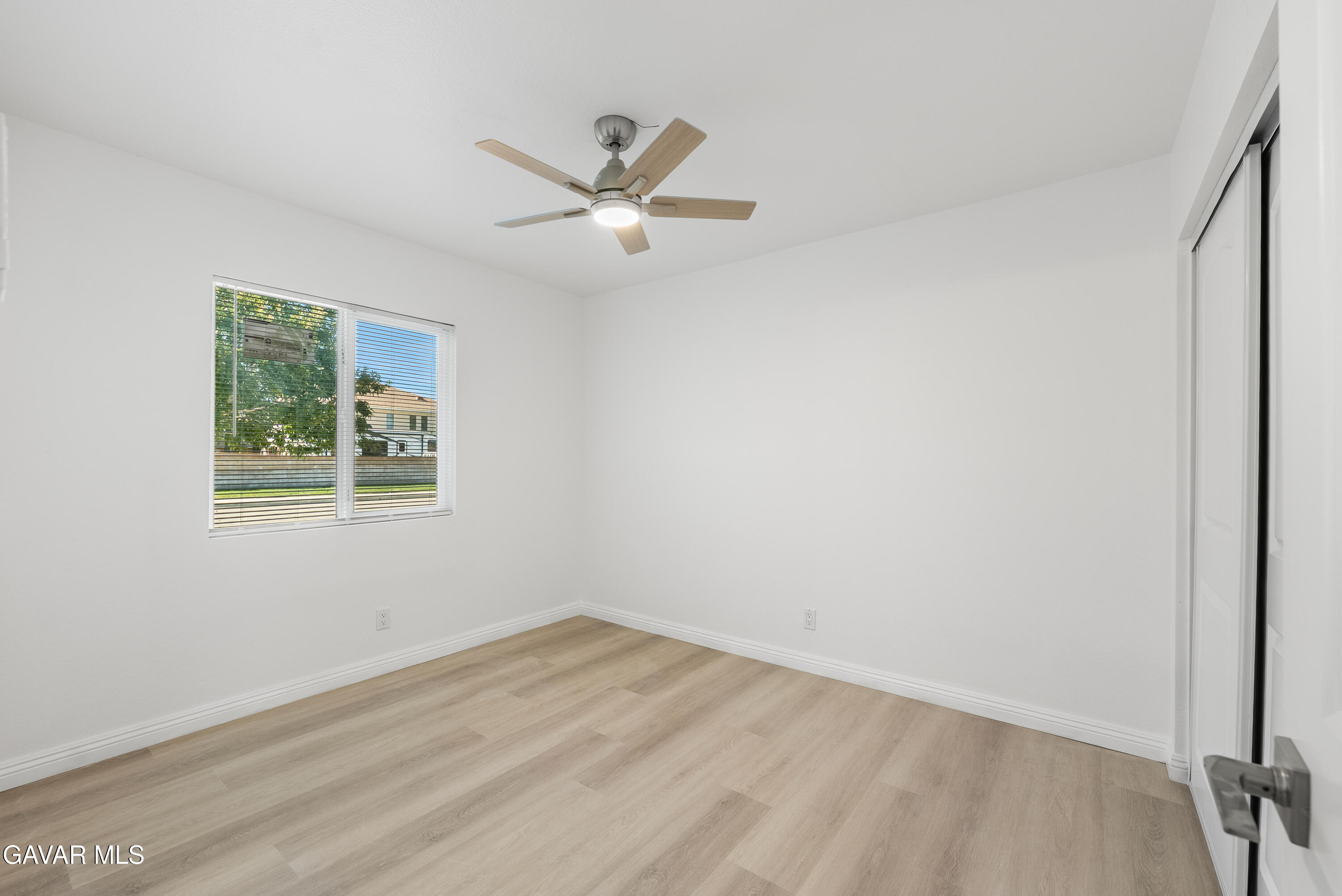 44238 Encanto Way Lancaster, CA 93536 - Photo 11 of 32 a view of a big room with wooden floor closet and windows