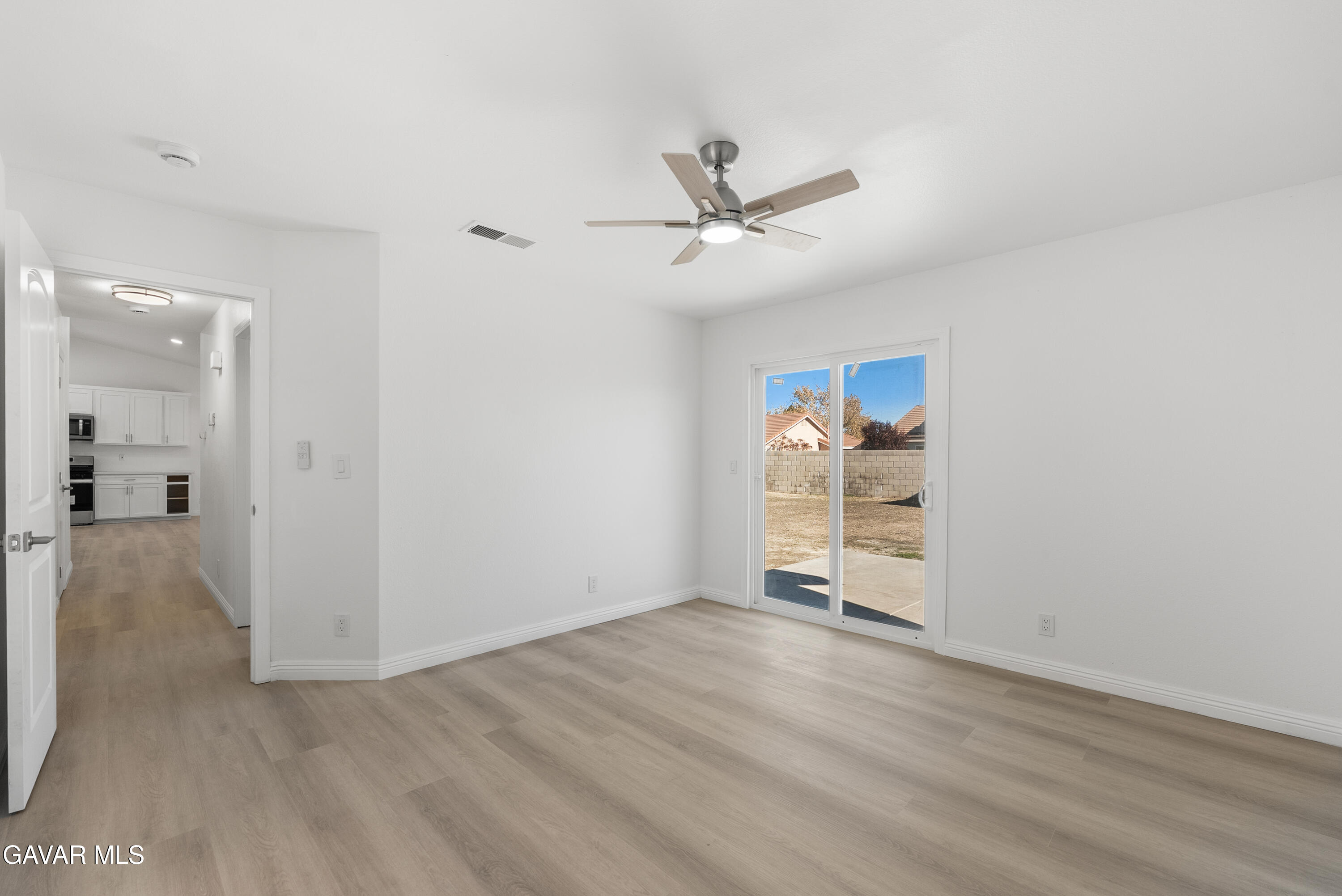 44238 Encanto Way Lancaster, CA 93536 - Photo 17 of 32 wooden floor in an empty room with a window