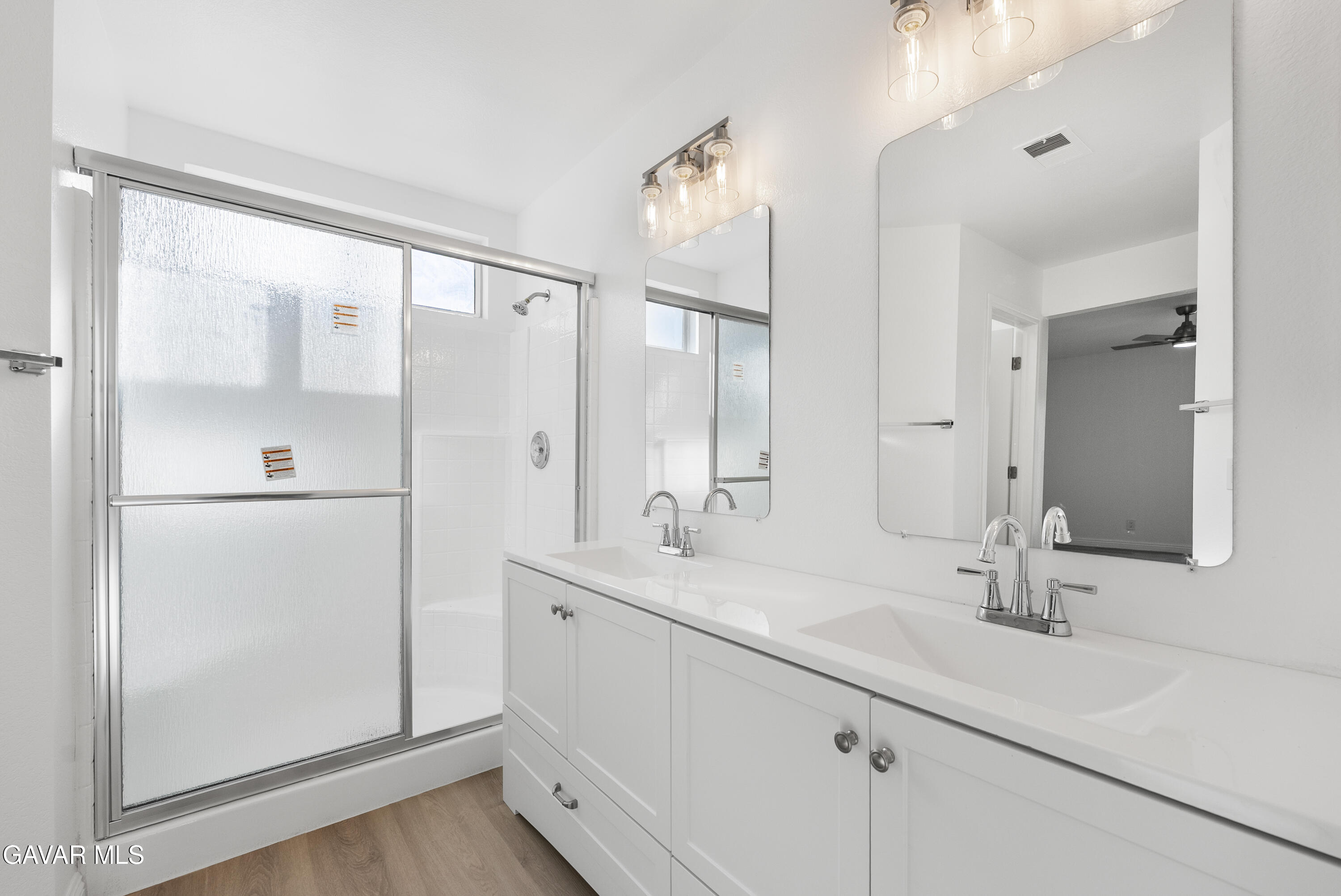 44238 Encanto Way Lancaster, CA 93536 - Photo 20 of 32 a bathroom with a double vanity sink mirror and double