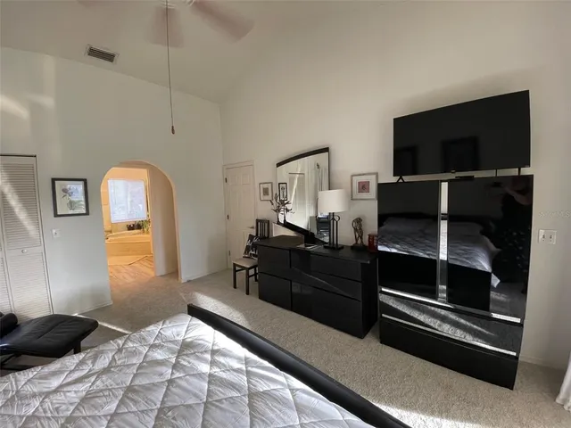 a bathroom with a sink toilet a mirror a bathtub and shower