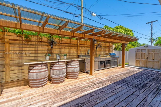 a view of a patio with table and chairs