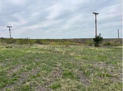 a view of a yard with an ocean view
