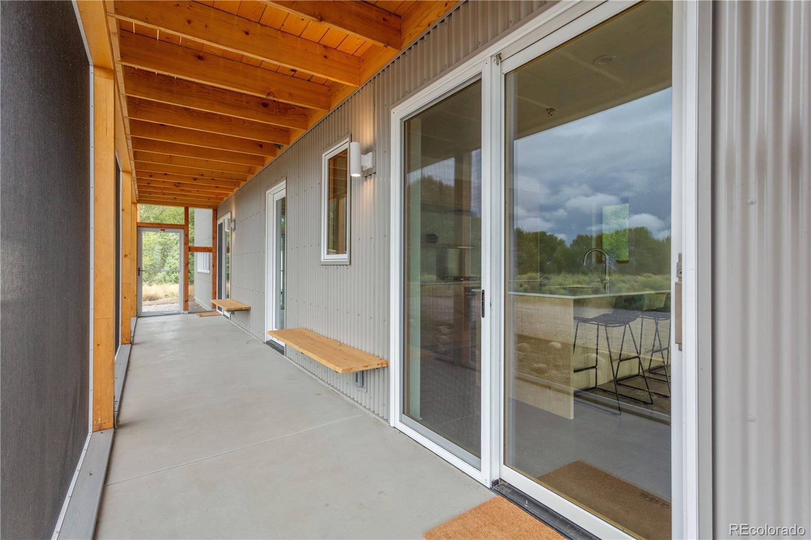 1276 Sycamore Road Crestone, CO 81131 - Photo 24 of 48 a view of a porch with a door