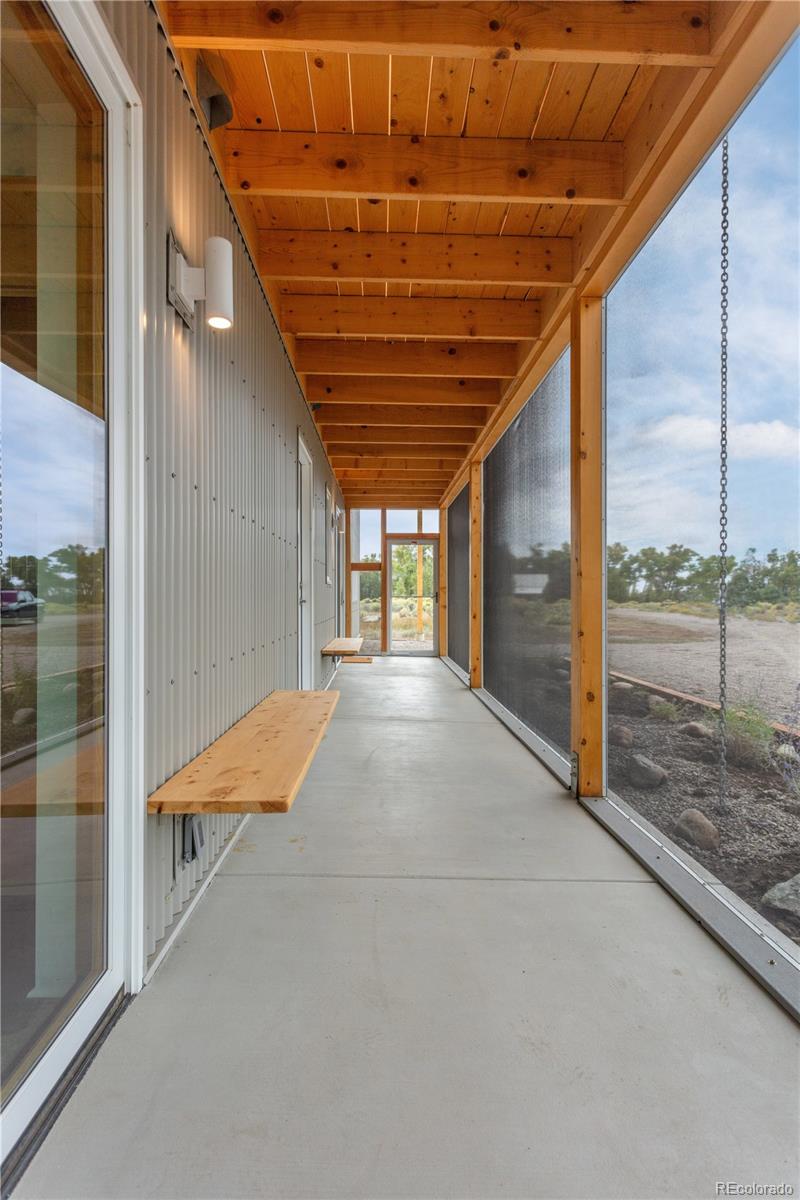 1276 Sycamore Road Crestone, CO 81131 - Photo 27 of 48 a view of an empty room with wooden floor