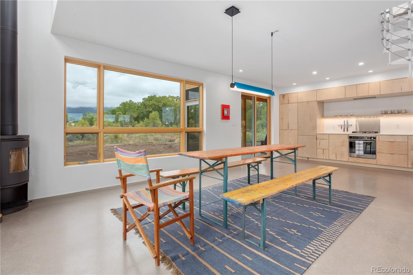 1276 Sycamore Road Crestone, CO 81131 - Photo 29 of 48 a view of a dining room with furniture window and outside view