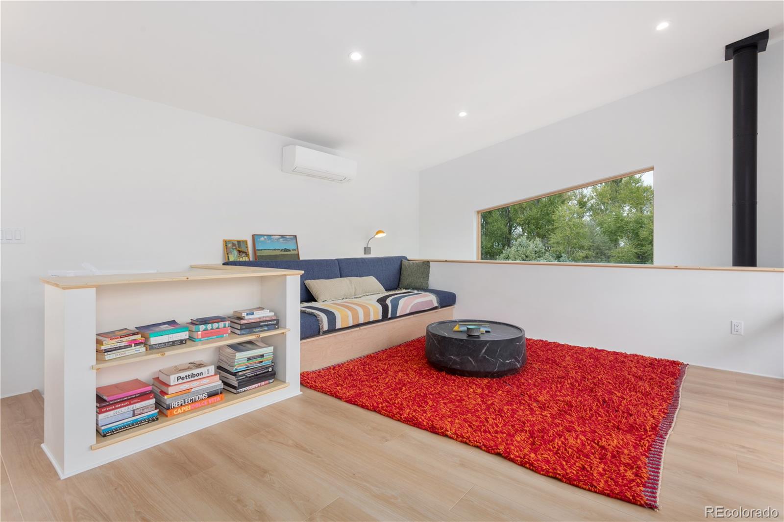 1276 Sycamore Road Crestone, CO 81131 - Photo 40 of 48 a living room with furniture and a flat screen tv