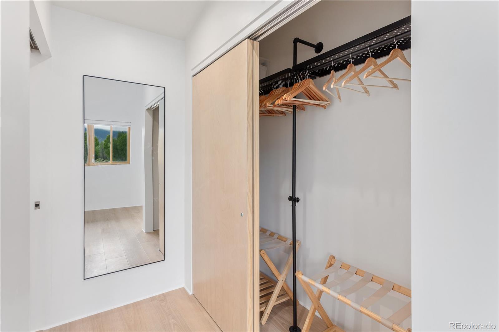 1276 Sycamore Road Crestone, CO 81131 - Photo 44 of 48 a view of walk in closet with clothes and white walls