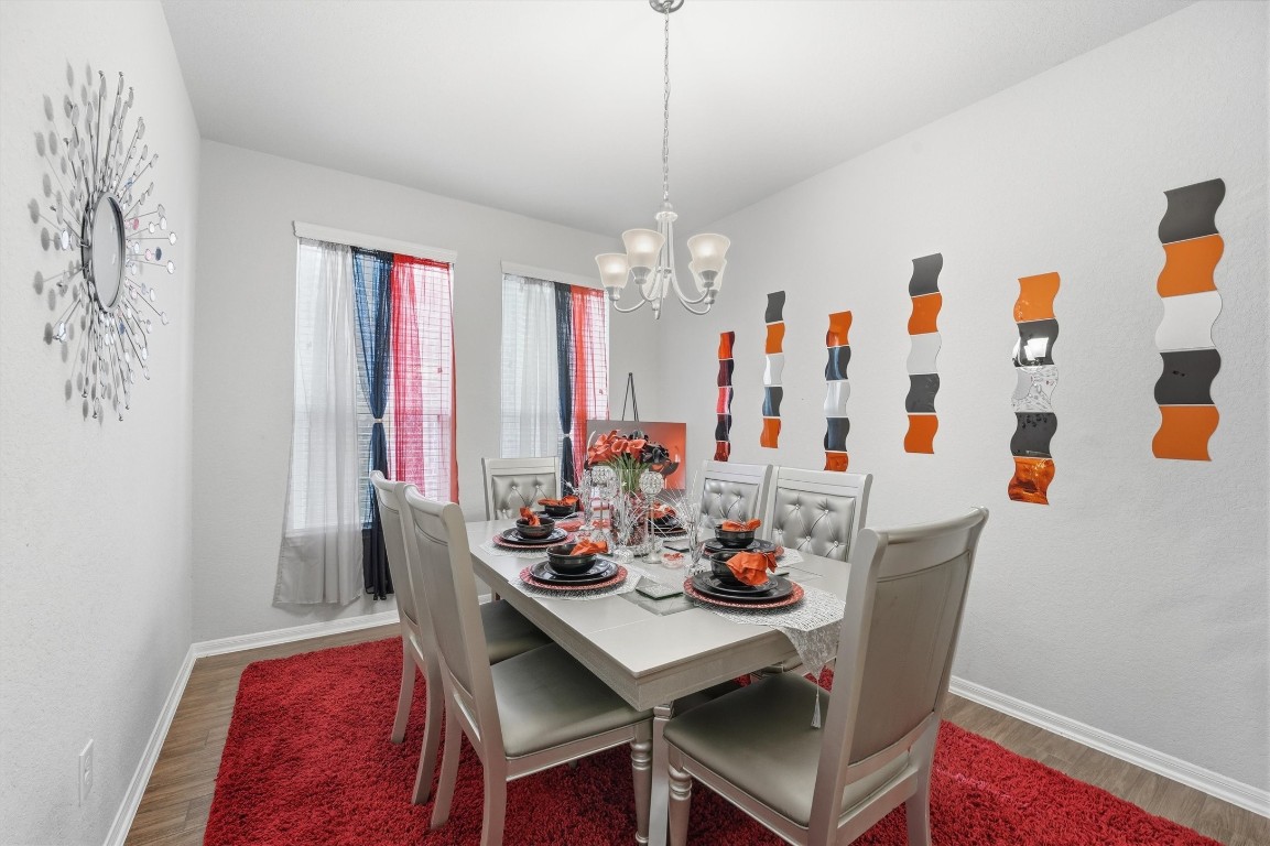 14706 Ruddy Duck Lane Houston, TX 77049 - Photo 13 of 32 a view of a dining room with furniture and chandelier