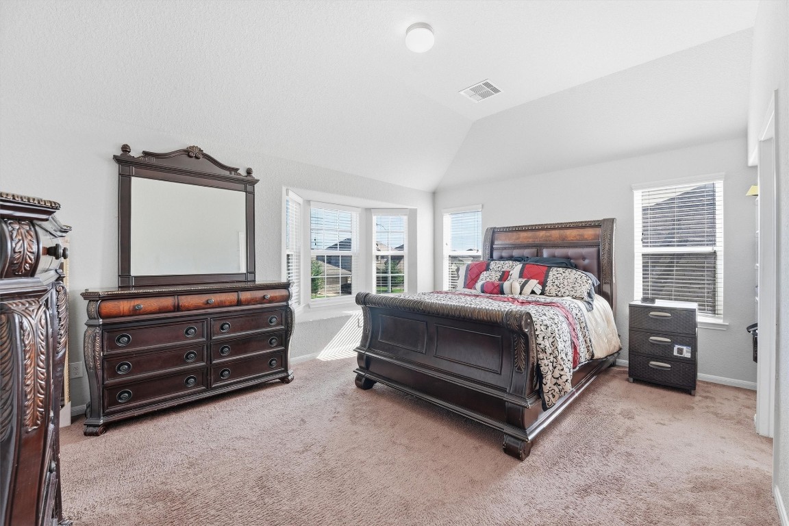 14706 Ruddy Duck Lane Houston, TX 77049 - Photo 19 of 32 a bedroom with a bed and a window