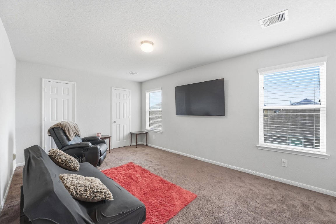 14706 Ruddy Duck Lane Houston, TX 77049 - Photo 23 of 32 a living room with furniture window and a flat screen tv