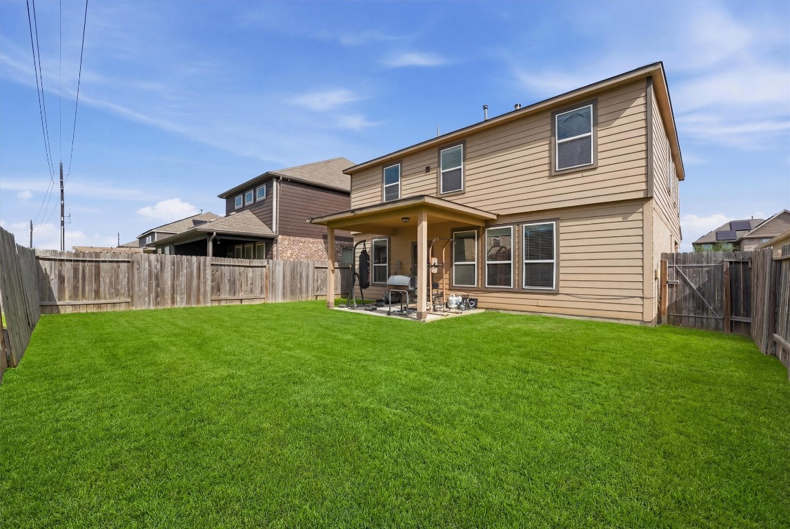 14706 Ruddy Duck Lane Houston, TX 77049 - Photo 27 of 32 a view of a house with backyard and porch
