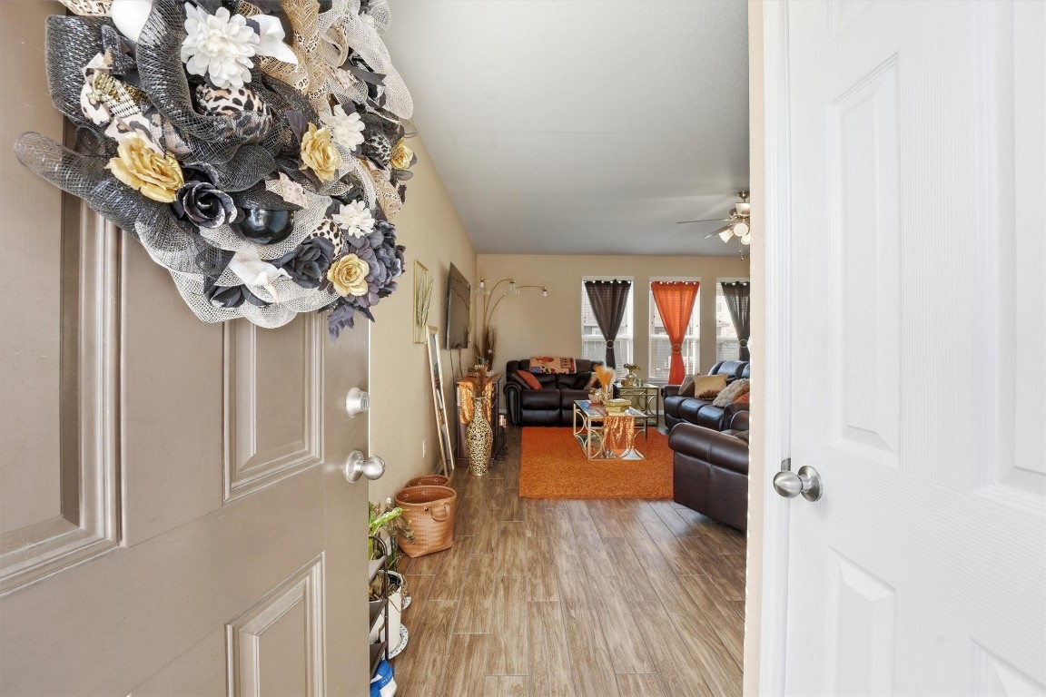 14706 Ruddy Duck Lane Houston, TX 77049 - Photo 5 of 32 a view of a dining hall with a dining table chairs and couches with wooden floor