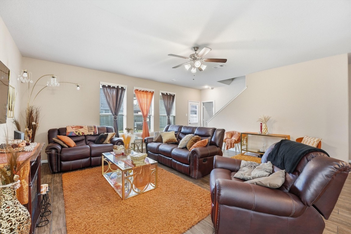 14706 Ruddy Duck Lane Houston, TX 77049 - Photo 6 of 32 a living room with furniture ceiling fan and a window