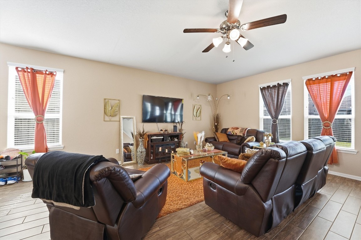 14706 Ruddy Duck Lane Houston, TX 77049 - Photo 7 of 32 a living room with furniture ceiling fan and a window