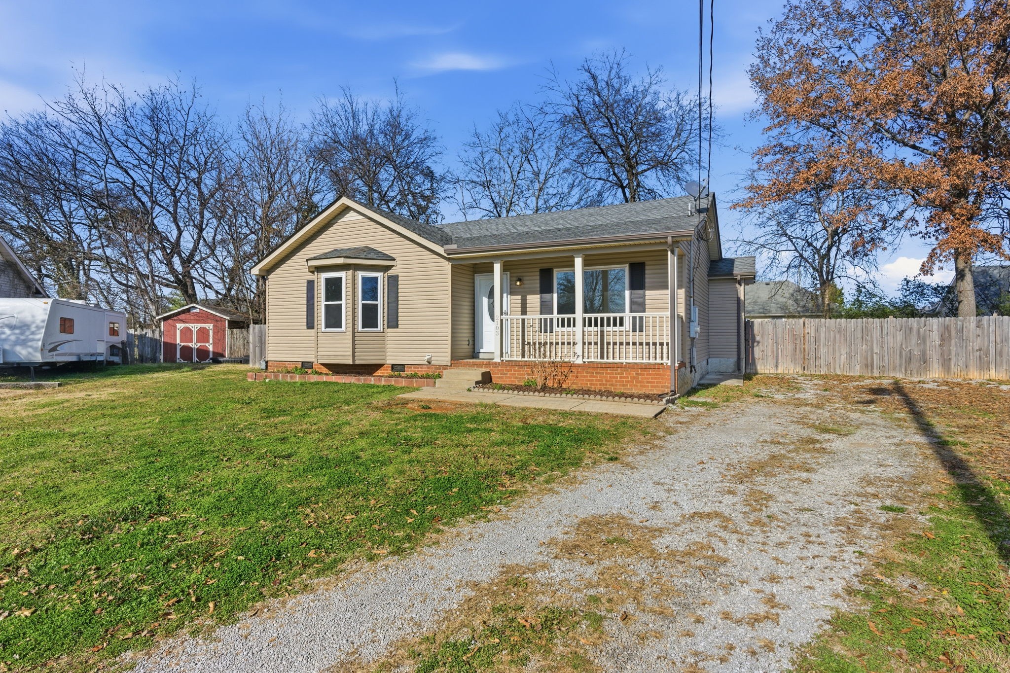2103 Halligen Court Murfreesboro, TN 37127 - Photo 3 of 16 a front view of a house with a garden and trees