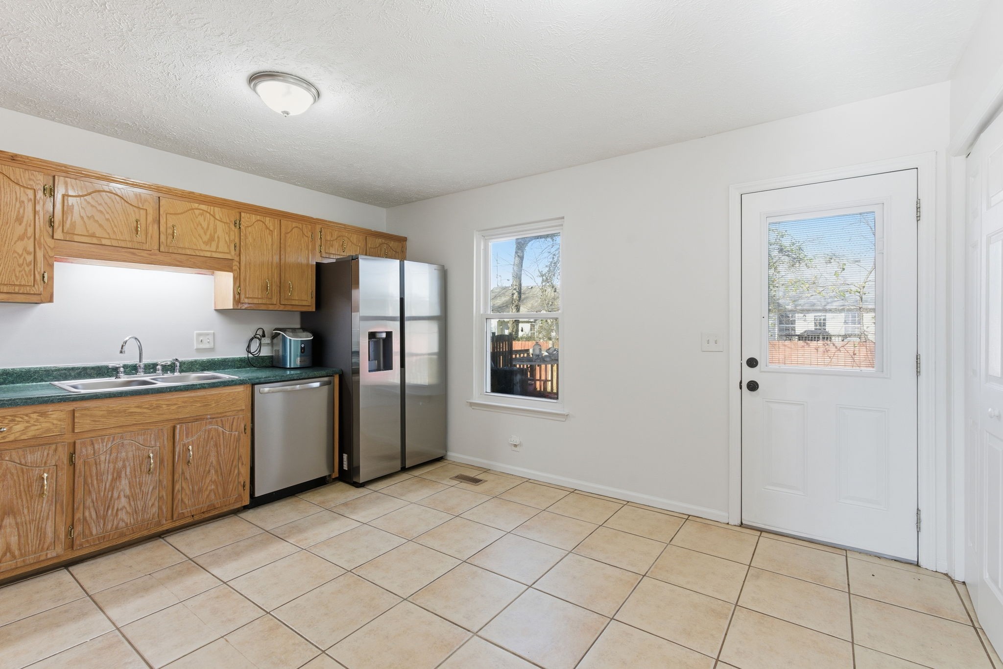 2103 Halligen Court Murfreesboro, TN 37127 - Photo 8 of 16 a kitchen with granite countertop a refrigerator and cabinets