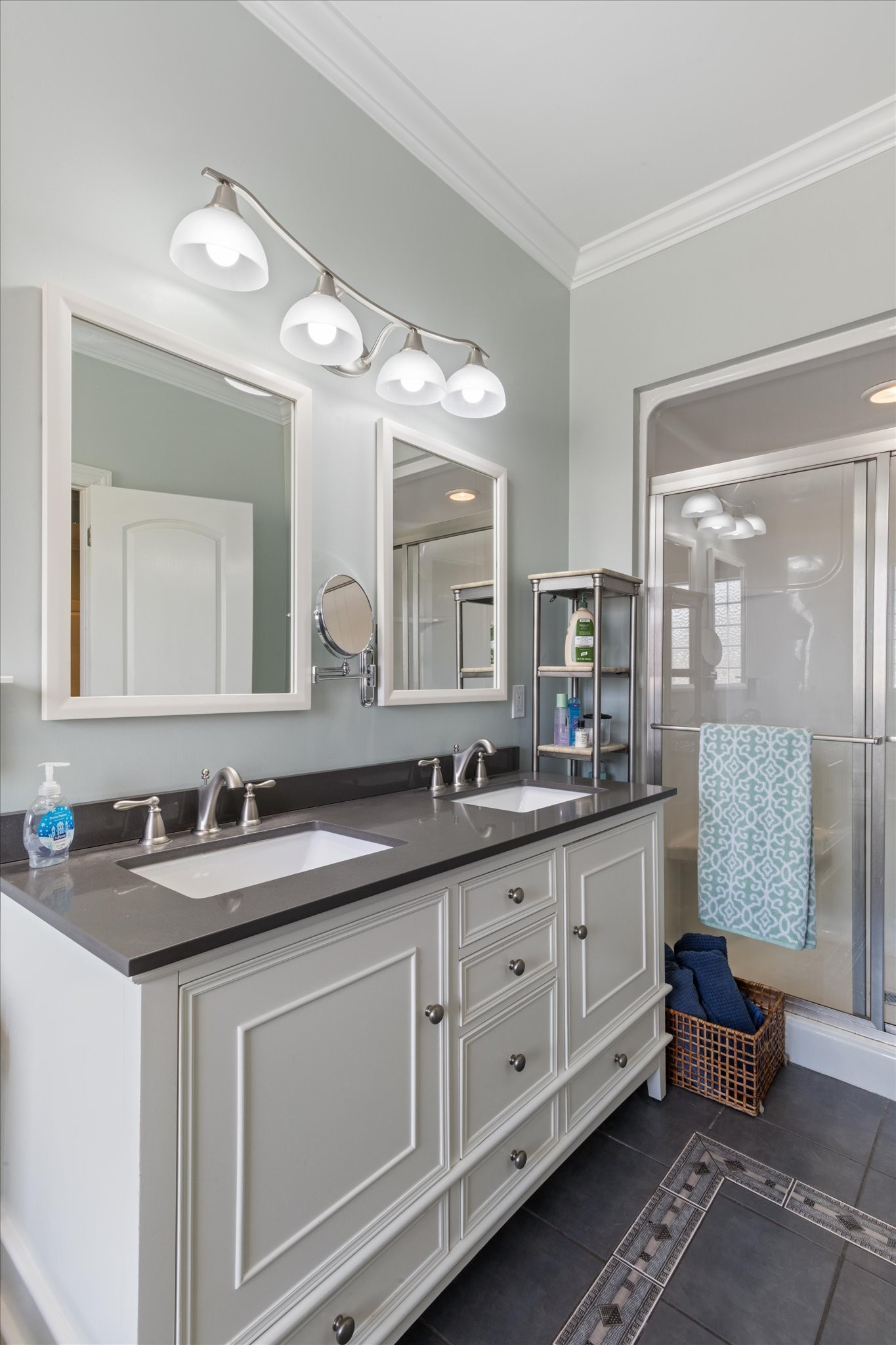 5087 Asbury Road Manchester, TN 37355 - Photo 26 of 33 a bathroom with double sink and a mirror