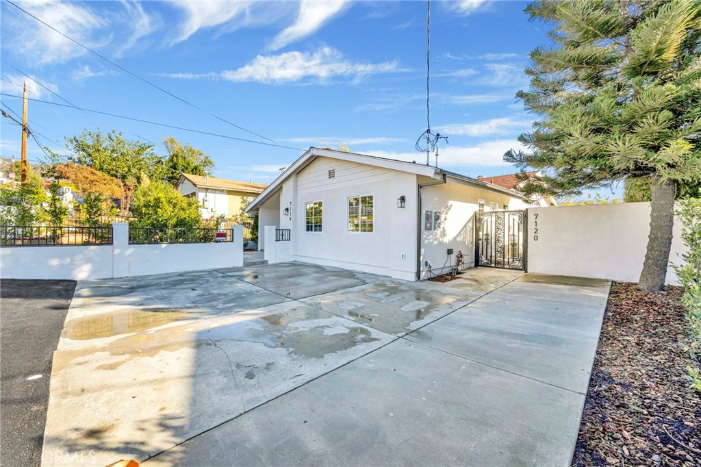7118 Apperson Street Tujunga, CA 91042 - Photo 2 of 25 a view of a house with a backyard