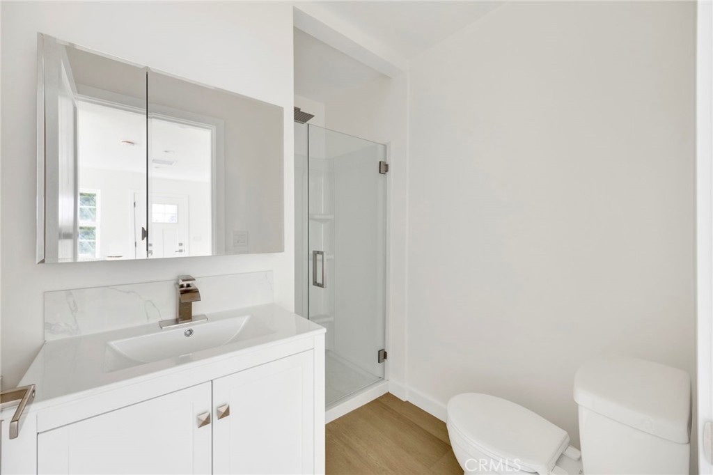 7118 Apperson Street Tujunga, CA 91042 - Photo 22 of 25 a bathroom with a sink toilet and vanity