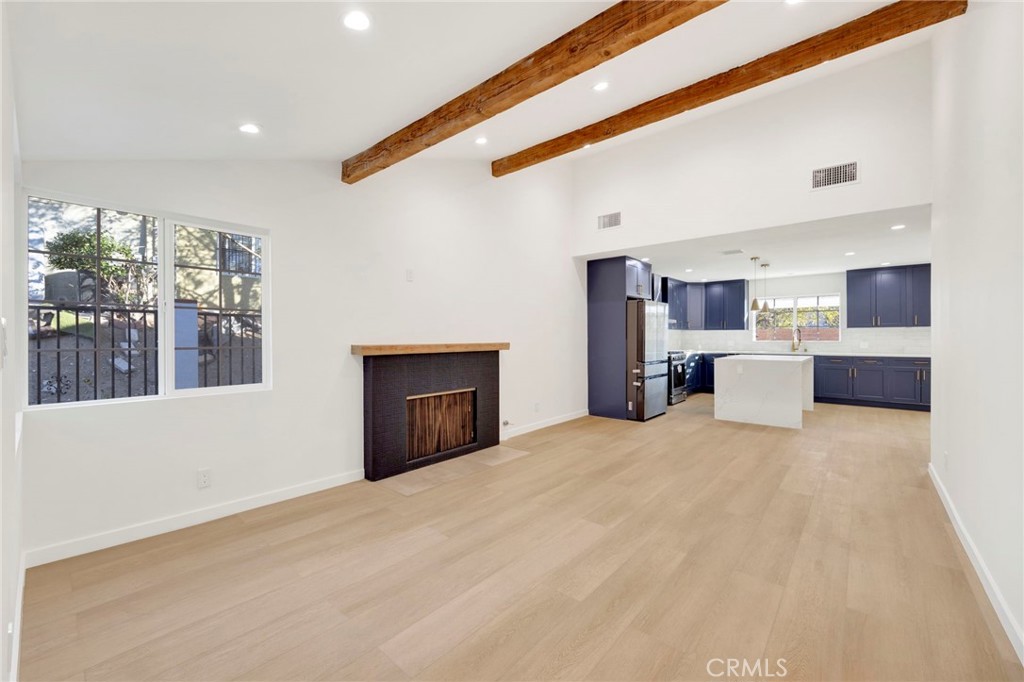 7118 Apperson Street Tujunga, CA 91042 - Photo 5 of 25 a view of a kitchen with a sink and a refrigerator