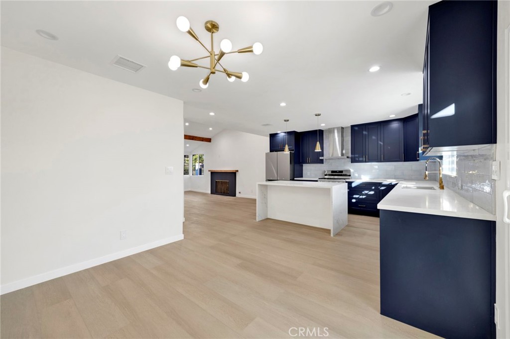 7118 Apperson Street Tujunga, CA 91042 - Photo 7 of 25 a view of kitchen with cabinets microwave and stove