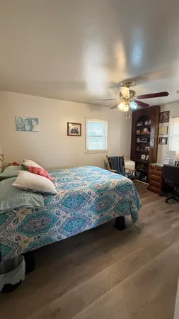 a bedroom with a bed and cabinets