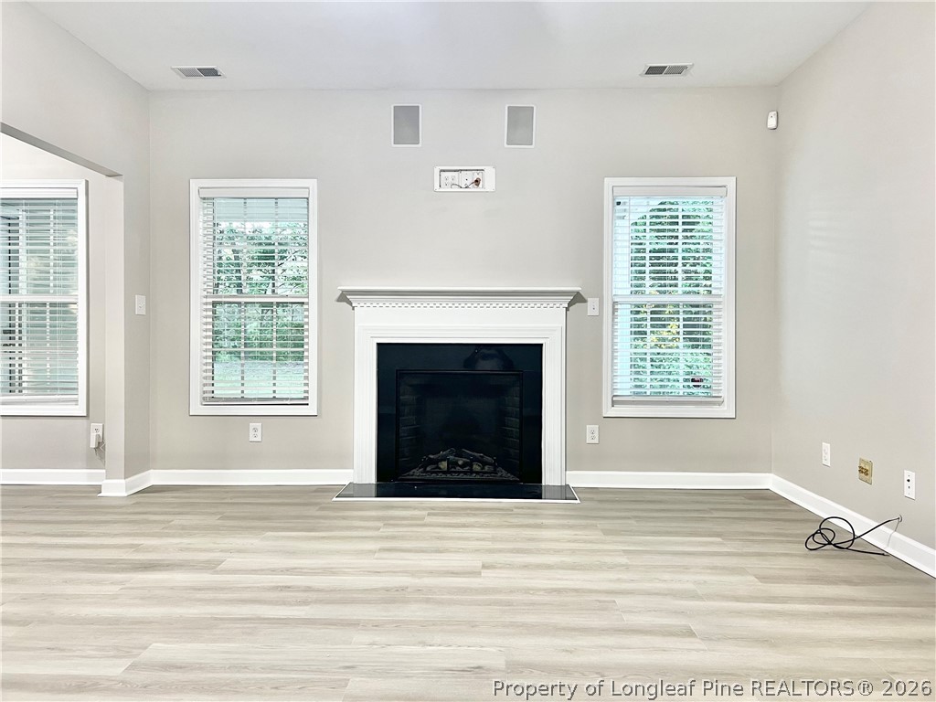 1523 Rough Rider Lane Parkton, NC 28371 - Photo 13 of 42 a view of a livingroom with a fireplace and window