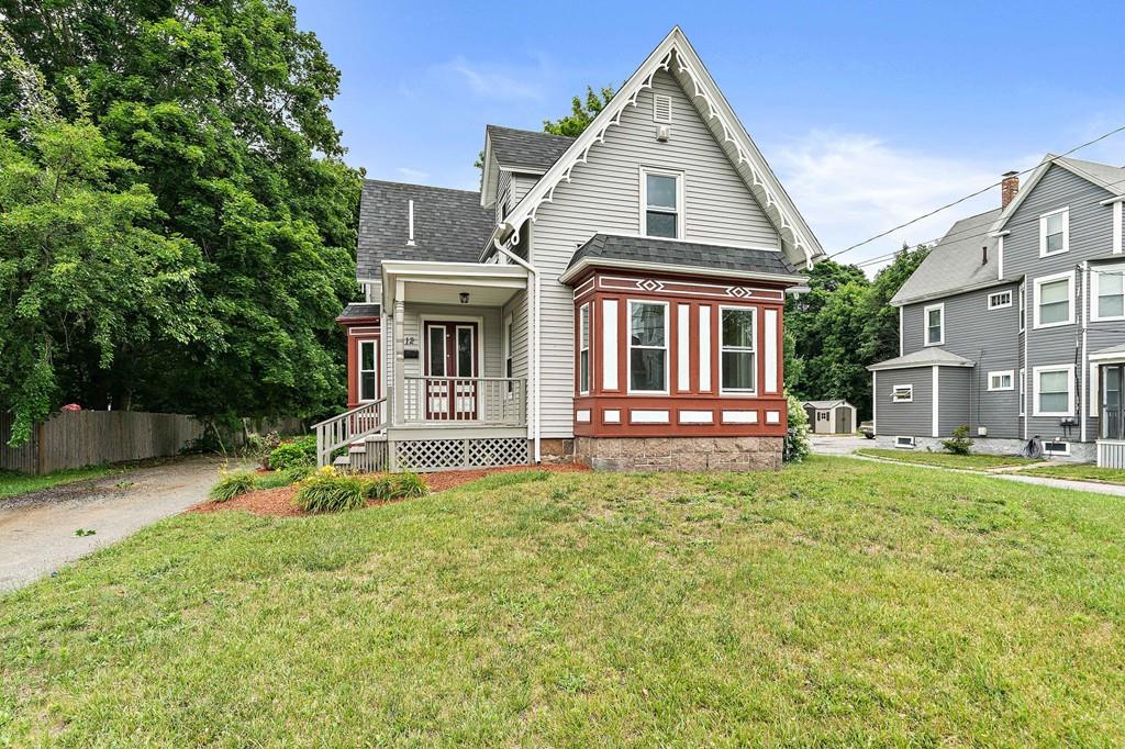 12 Madison Street Taunton, MA 02780 - Photo 1 of 23 a front view of a house with a yard