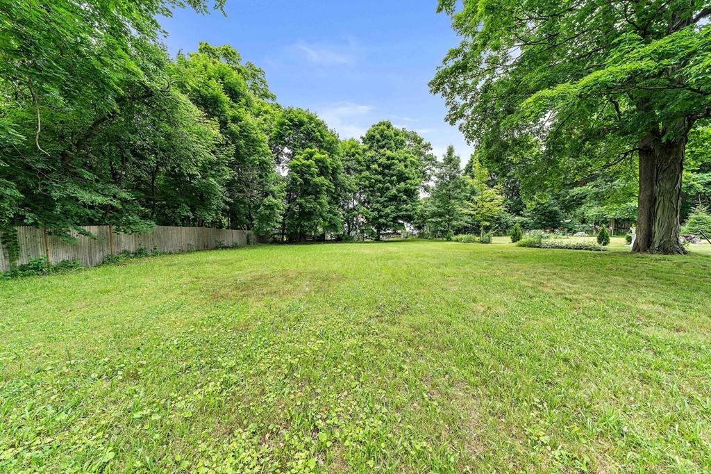 12 Madison Street Taunton, MA 02780 - Photo 20 of 23 a view of a grassy field with trees in the background