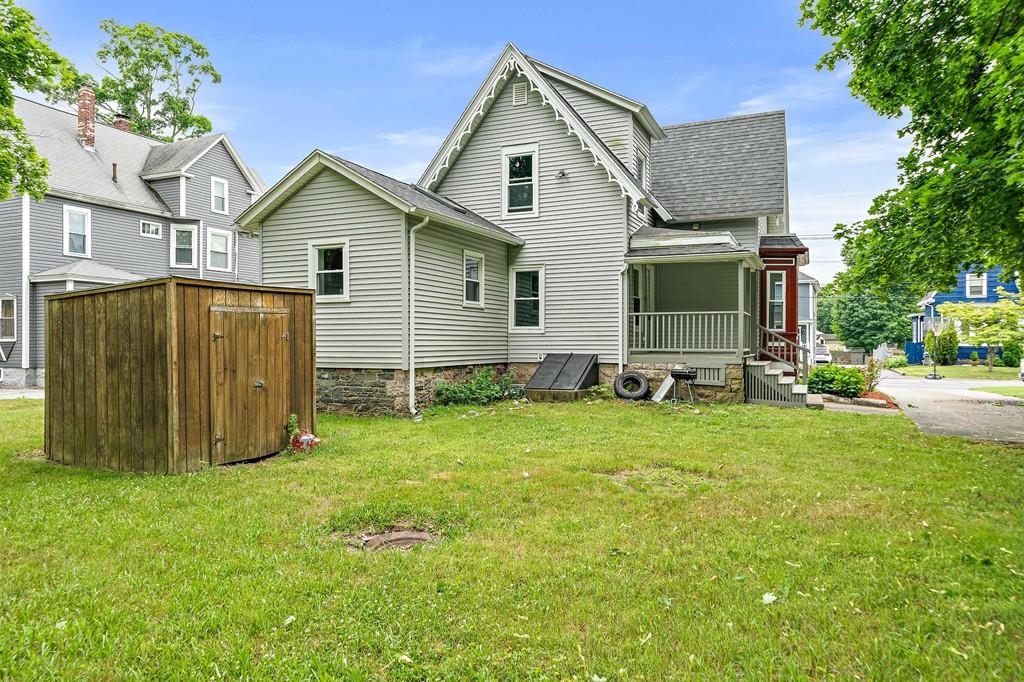 12 Madison Street Taunton, MA 02780 - Photo 21 of 23 a view of backyard with barbeque grill and a large tree