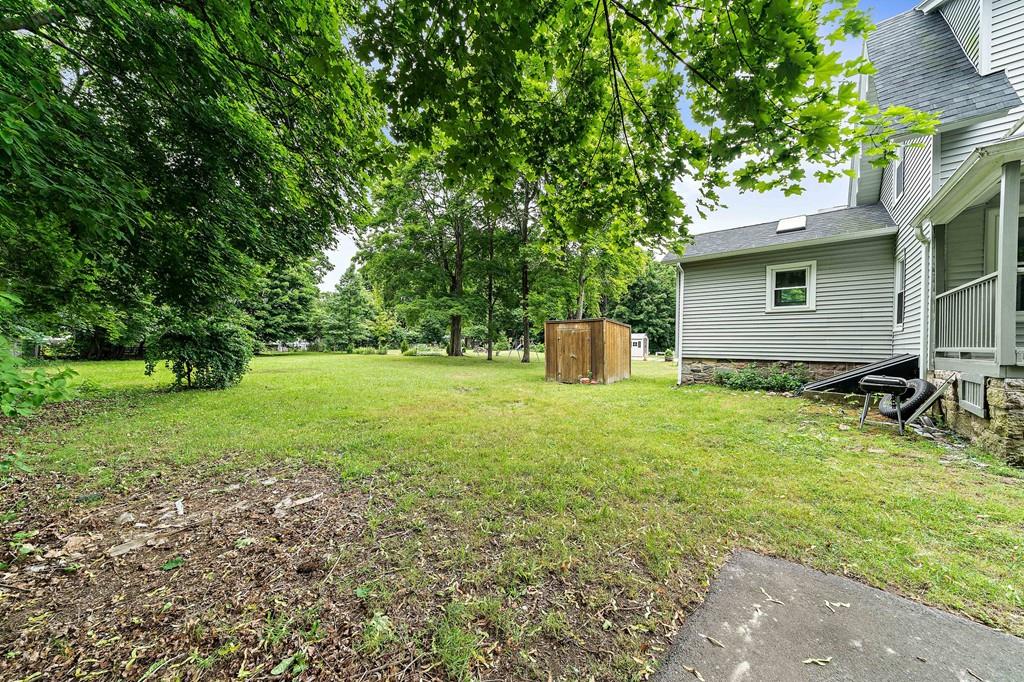 12 Madison Street Taunton, MA 02780 - Photo 22 of 23 a backyard of a house with seating space