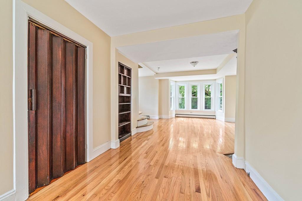 12 Madison Street Taunton, MA 02780 - Photo 5 of 23 a view of a room with wooden floor and stairs