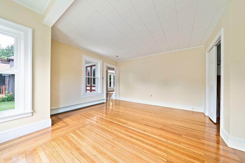 12 Madison Street Taunton, MA 02780 - Photo 9 of 23 a view of an empty room with wooden floor and a window