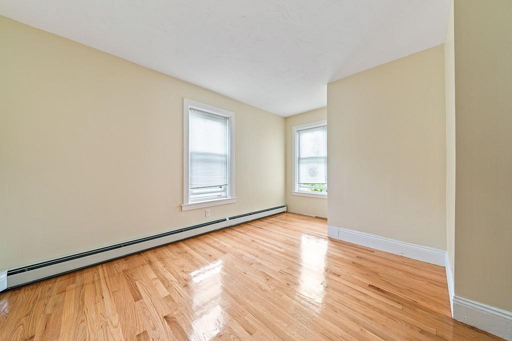 12 Madison Street Taunton, MA 02780 - Photo 10 of 23 a view of an empty room with wooden floor and a window