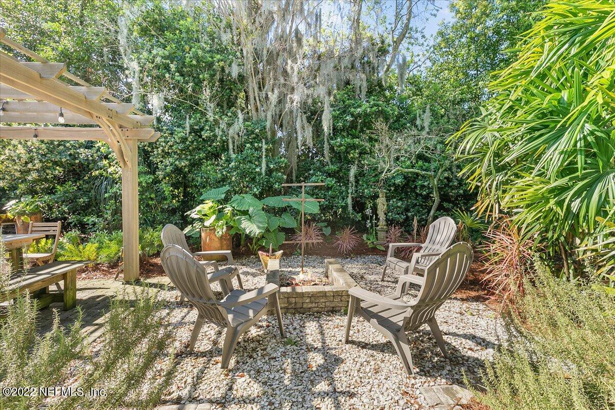 1626 Brookwood Road Jacksonville, FL 32207 - Photo 18 of 27 a view of backyard with table and chairs and couches