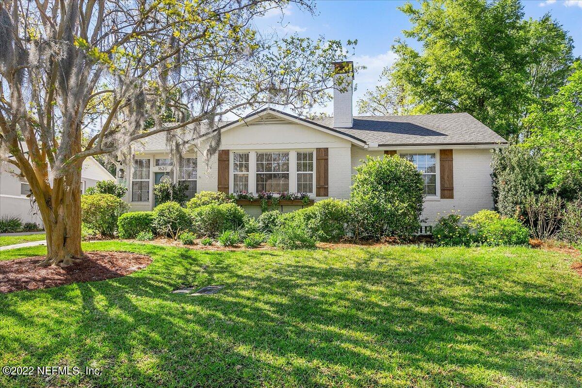 1626 Brookwood Road Jacksonville, FL 32207 - Photo 2 of 27 a front view of a house with a yard and trees