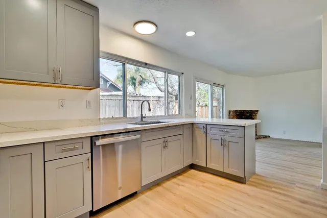 a kitchen with a sink and a window