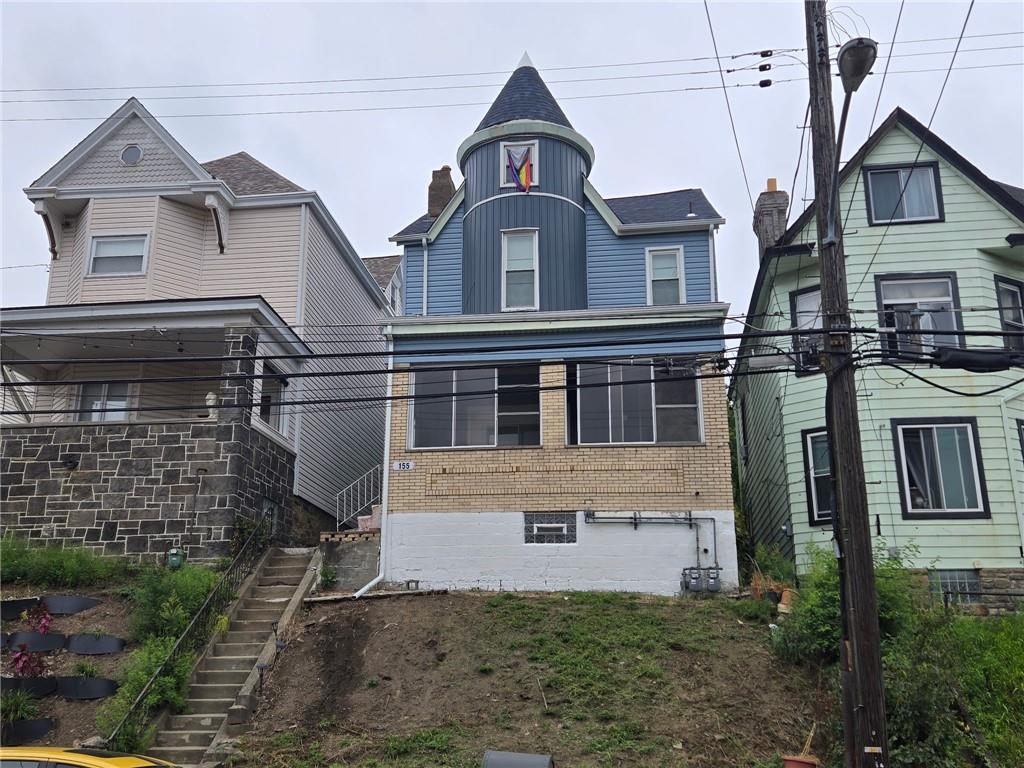 155 Labelle Street, Unit 2 Pittsburgh, PA 15211 - Photo 19 of 22 a view of a big house with wooden fence