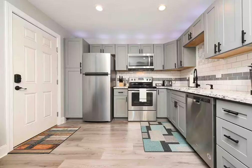 155 Labelle Street, Unit 2 Pittsburgh, PA 15211 - Photo 2 of 22 a kitchen with stainless steel appliances granite countertop a refrigerator sink and stove