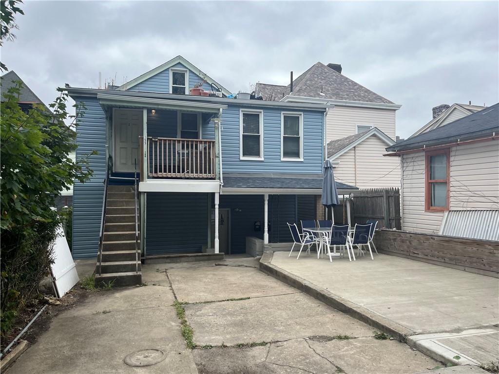 155 Labelle Street, Unit 2 Pittsburgh, PA 15211 - Photo 21 of 22 a front view of a house with a yard and garage