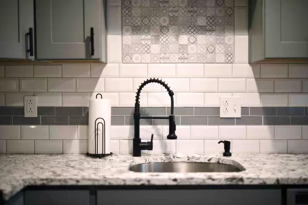 155 Labelle Street, Unit 2 Pittsburgh, PA 15211 - Photo 4 of 22 a kitchen with granite countertop a sink and a wooden cabinets