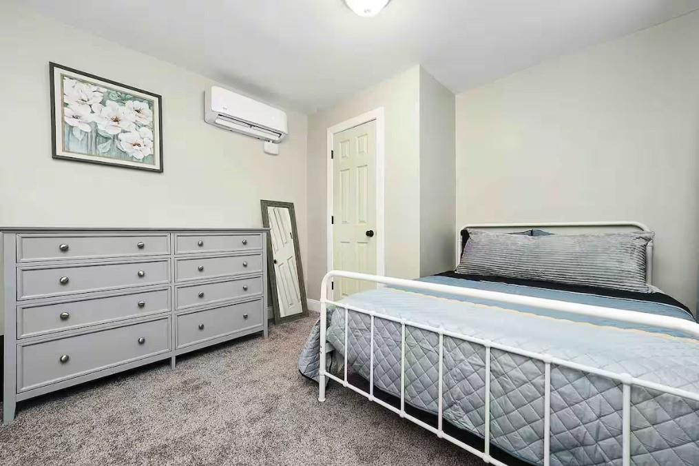 155 Labelle Street, Unit 2 Pittsburgh, PA 15211 - Photo 6 of 22 a bedroom with a bed and a dresser