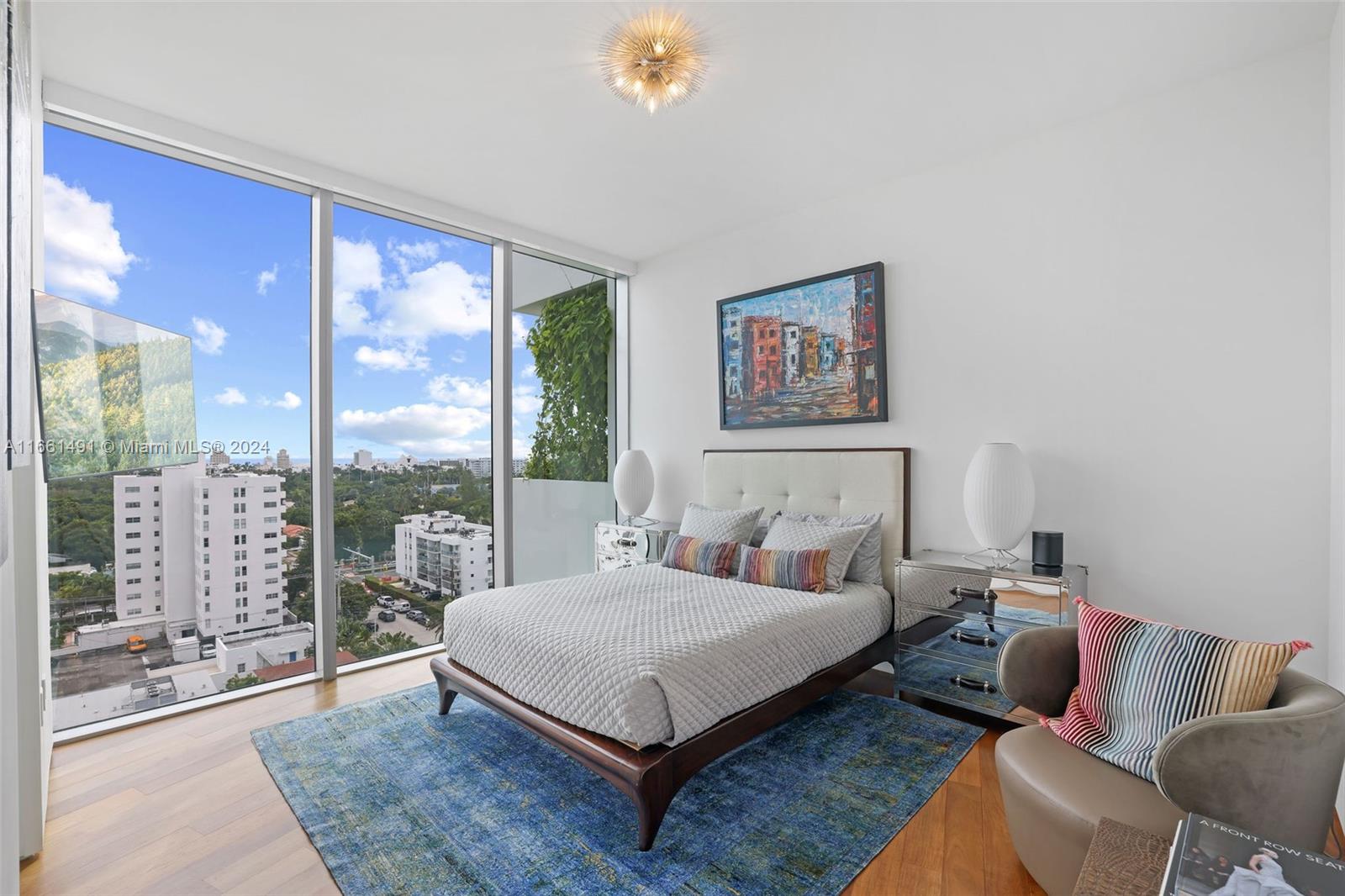 1300 Monad Terrace, Unit 9B Miami Beach, FL 33139 - Photo 11 of 34 a bedroom with a large bed and a couch