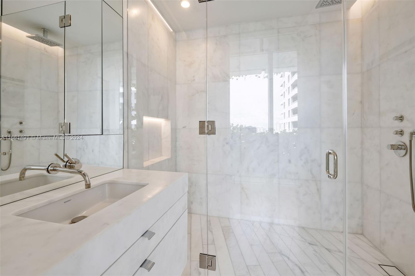 1300 Monad Terrace, Unit 9B Miami Beach, FL 33139 - Photo 14 of 34 a bathroom with a sink and a mirror