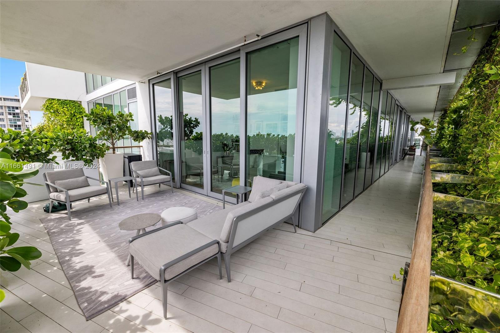 1300 Monad Terrace, Unit 9B Miami Beach, FL 33139 - Photo 15 of 34 a balcony with furniture and garden view