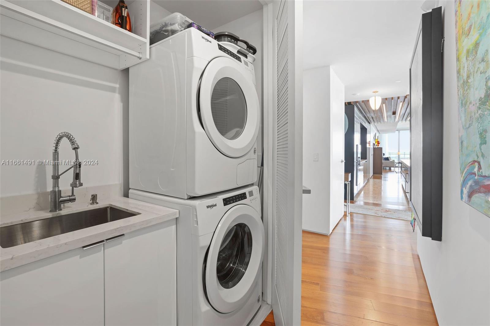 1300 Monad Terrace, Unit 9B Miami Beach, FL 33139 - Photo 18 of 34 a view of a kitchen with a washer and dryer