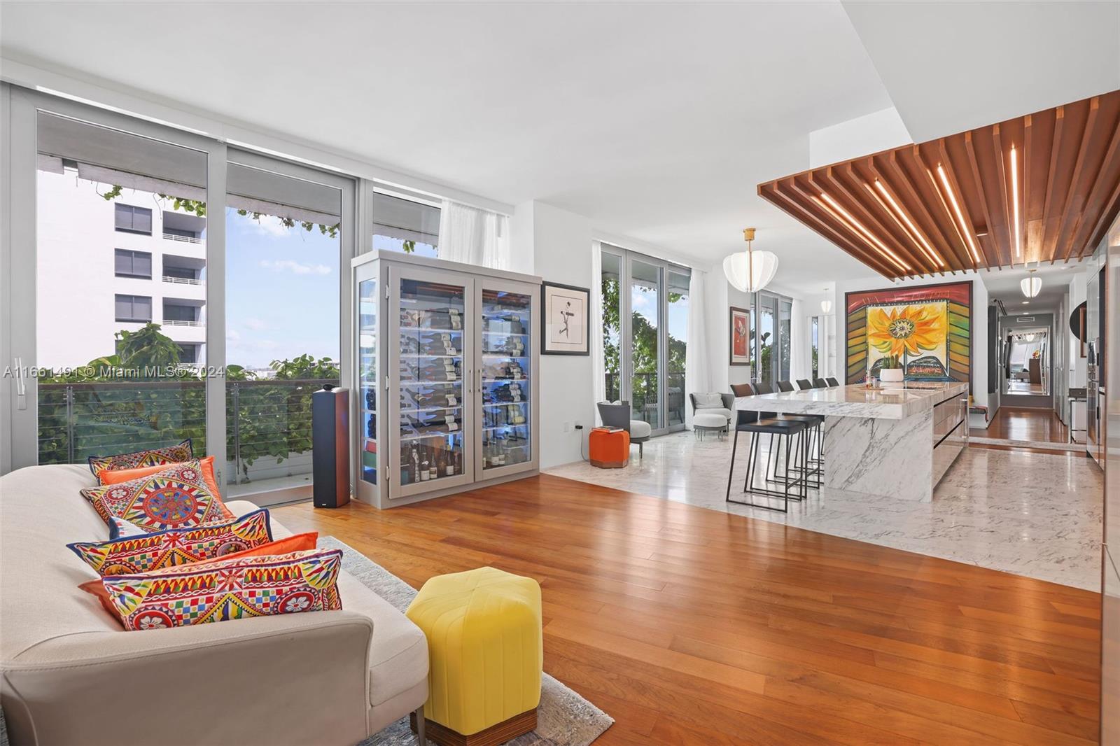 1300 Monad Terrace, Unit 9B Miami Beach, FL 33139 - Photo 22 of 34 a living room with furniture floor to ceiling window and wooden floor