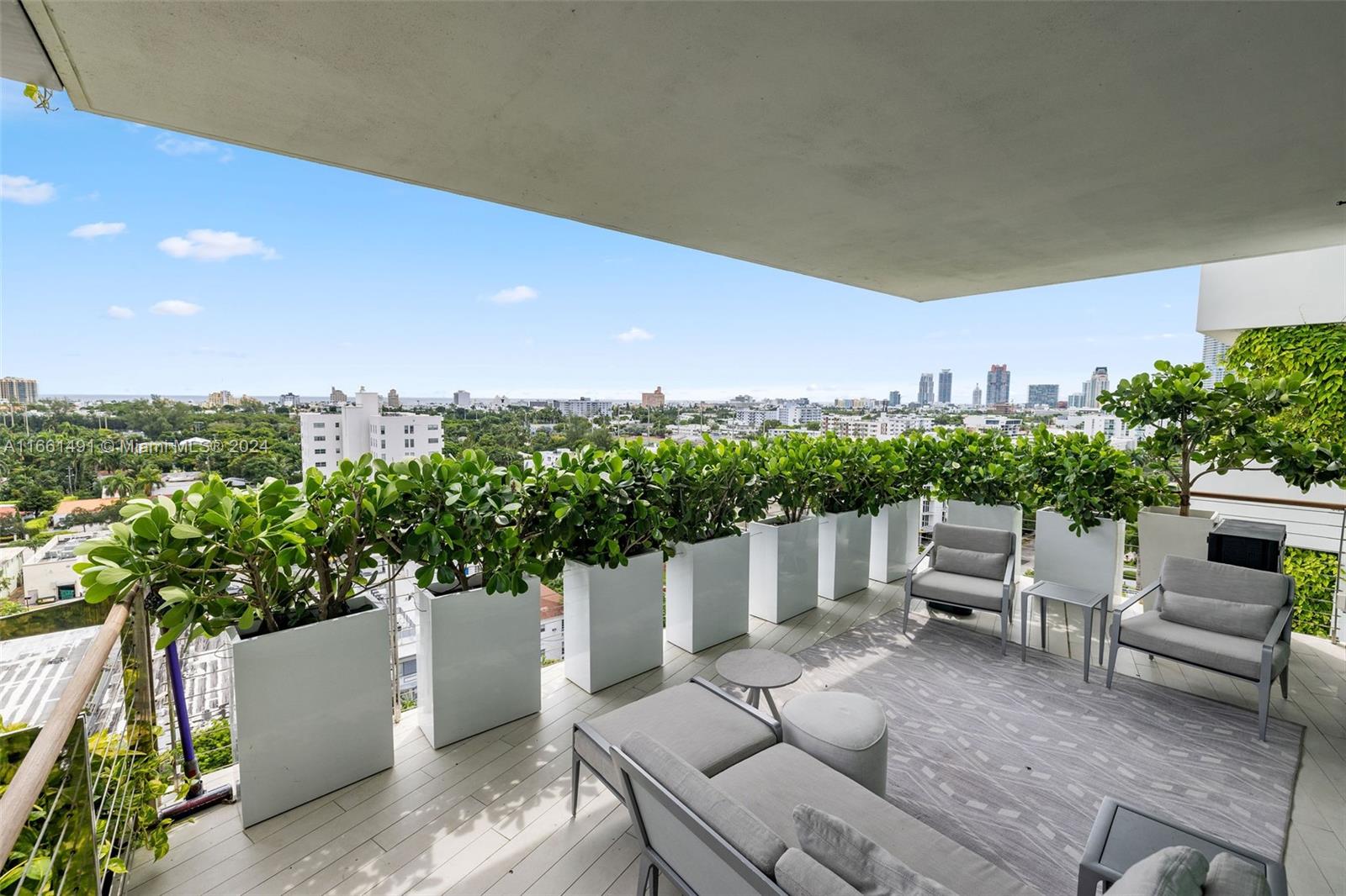 1300 Monad Terrace, Unit 9B Miami Beach, FL 33139 - Photo 25 of 34 a view of a patio with couches table and chairs and potted plants