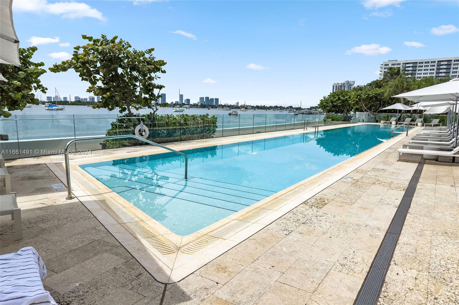 1300 Monad Terrace, Unit 9B Miami Beach, FL 33139 - Photo 27 of 34 swimming pool with outdoor seating and yard in the back