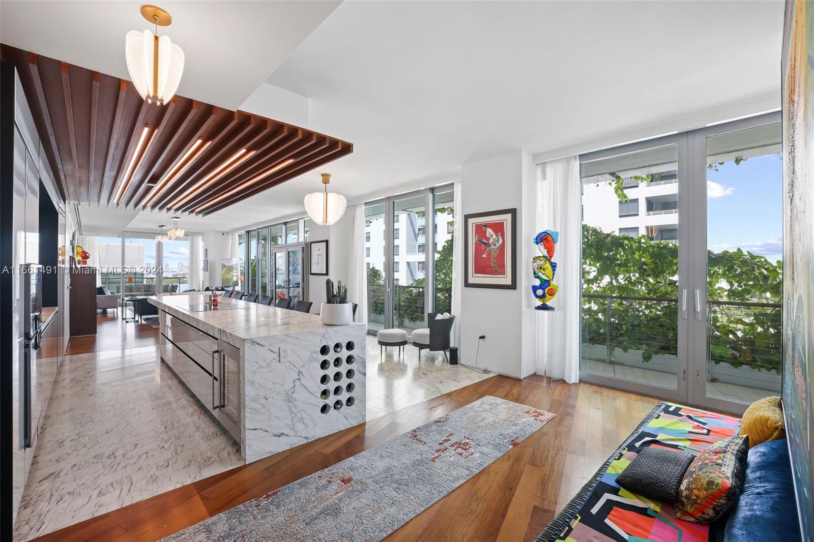 1300 Monad Terrace, Unit 9B Miami Beach, FL 33139 - Photo 3 of 34 a living room with furniture and a floor to ceiling window